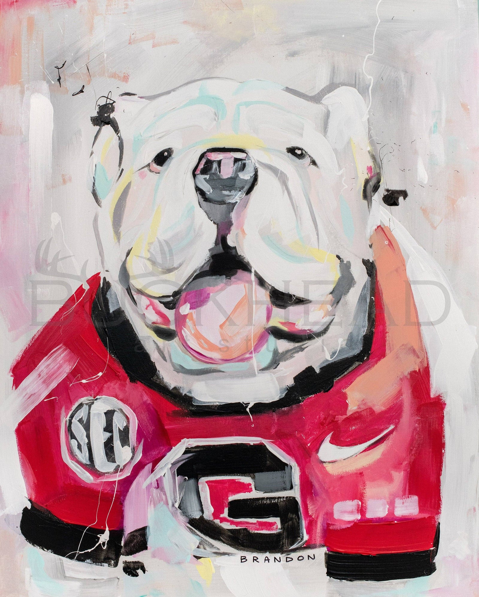 Framed artwork of a bulldog wearing a red jersey with a logo on a white background
