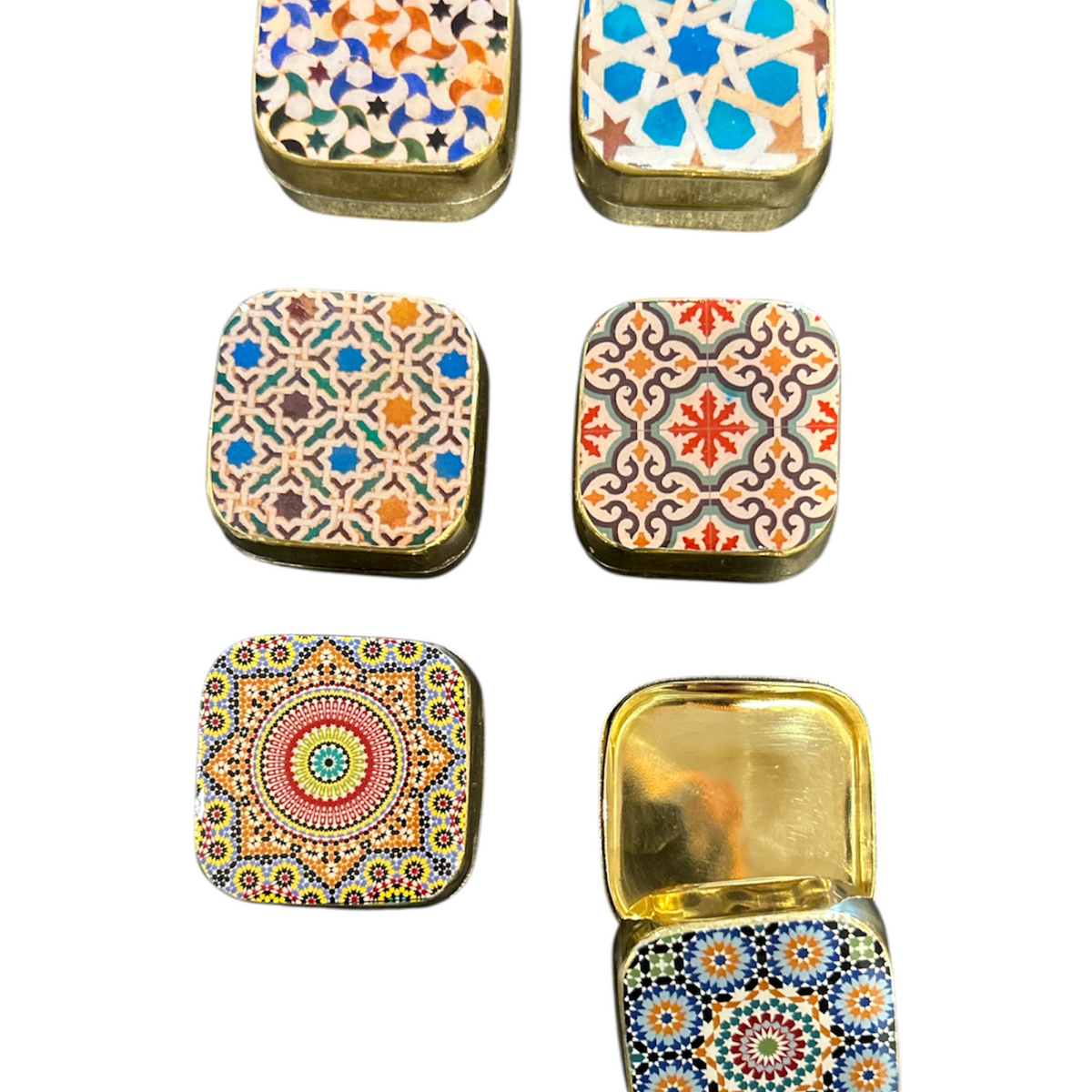 Set of six decorative tin boxes with colorful patterns on a white background