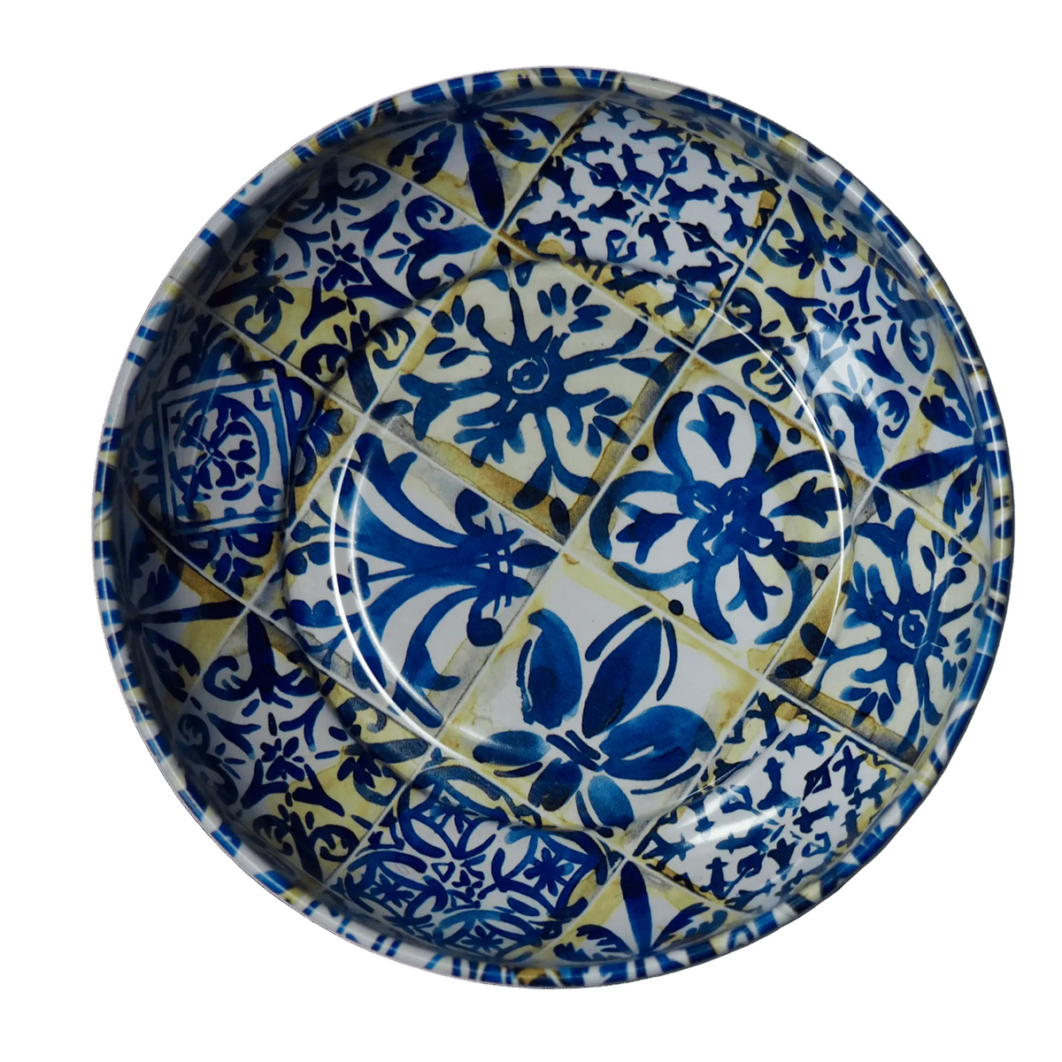 Ceramic plate with blue and white floral patterns on a green background