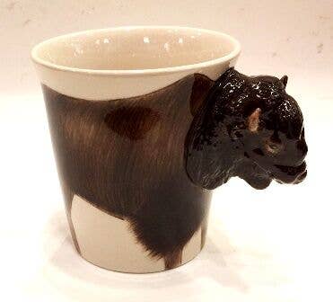 Ceramic mug with a bison head design on a white background