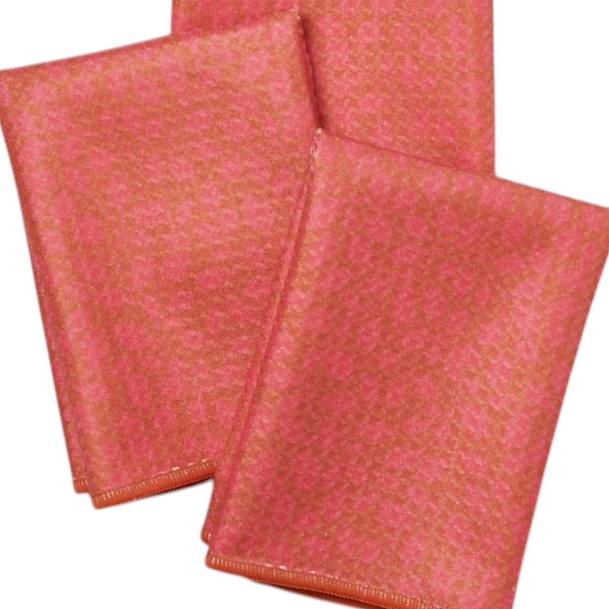 Three red patterned napkins on a white background