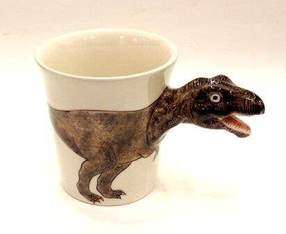 A white ceramic cup with a 3D dinosaur figure attached to the side