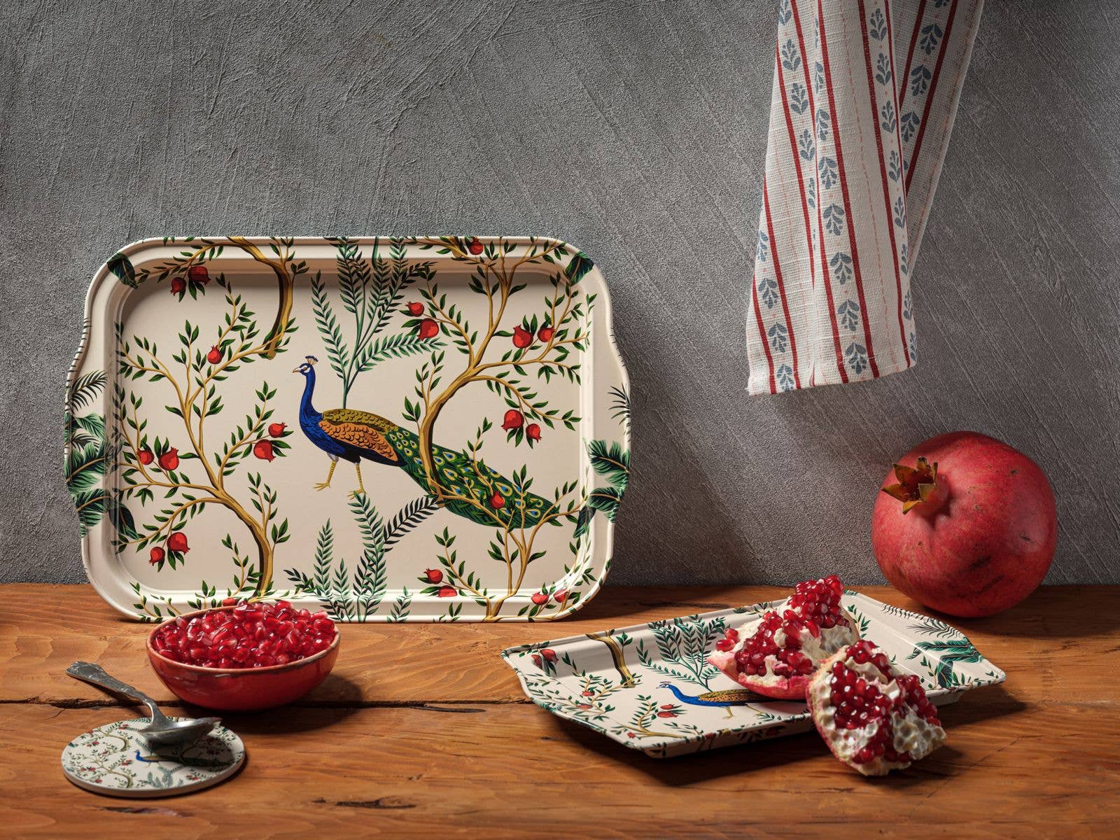 Decorative tray with peacock and floral design on a white background