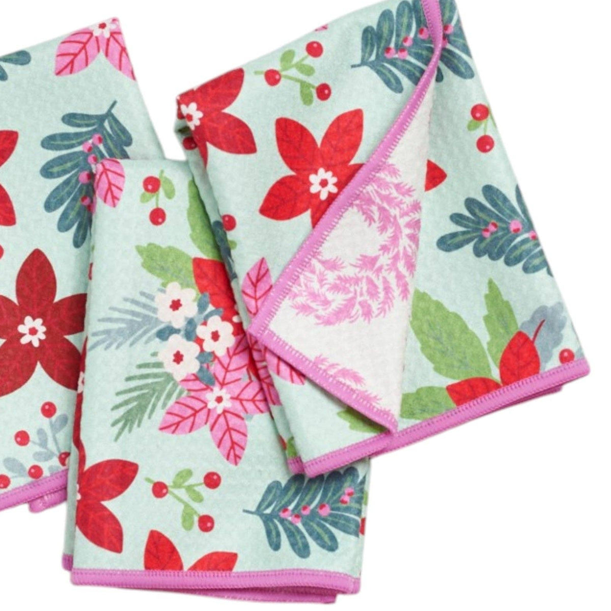 Set of three floral patterned towels on a white background