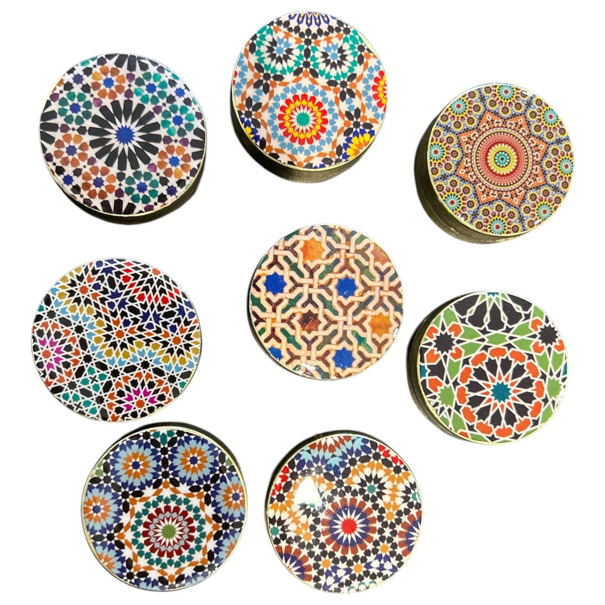 Set of colorful circular coasters with geometric patterns on a white background